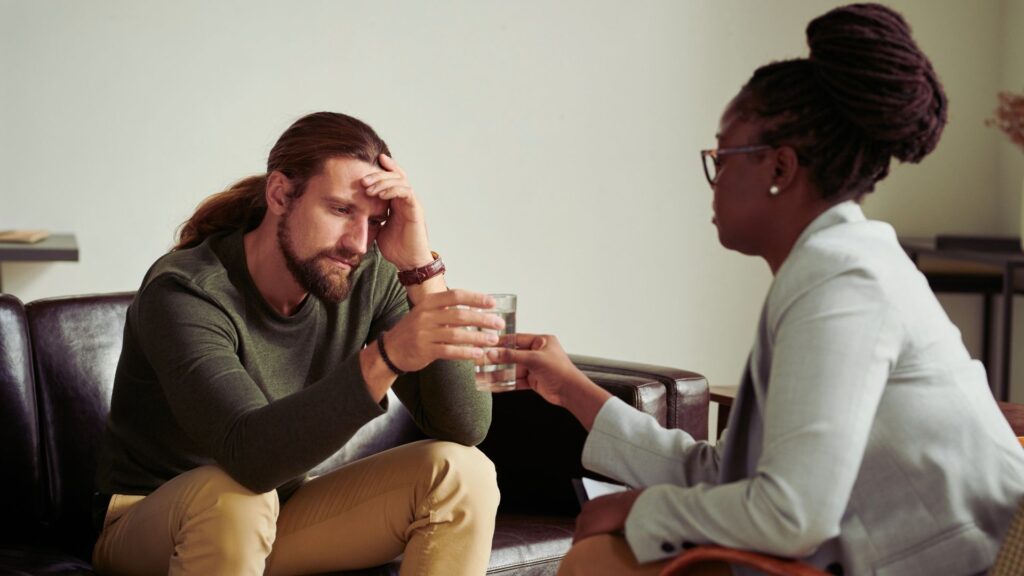 therapist consults with a patient experiencing relapse