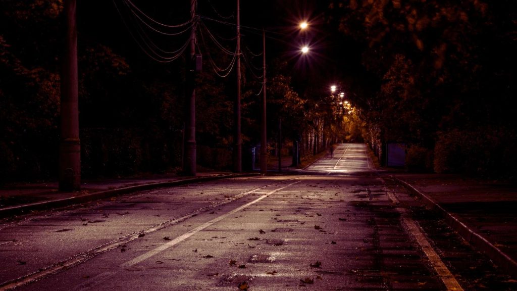 Empty street at night symbolizing isolation linked to heroin addiction