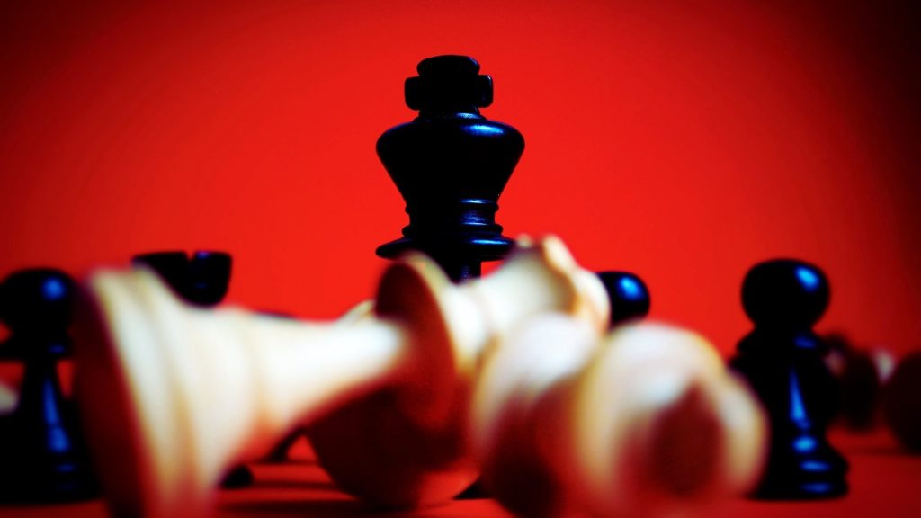 Fallen chess king symbolizing loss of control and behavioral changes