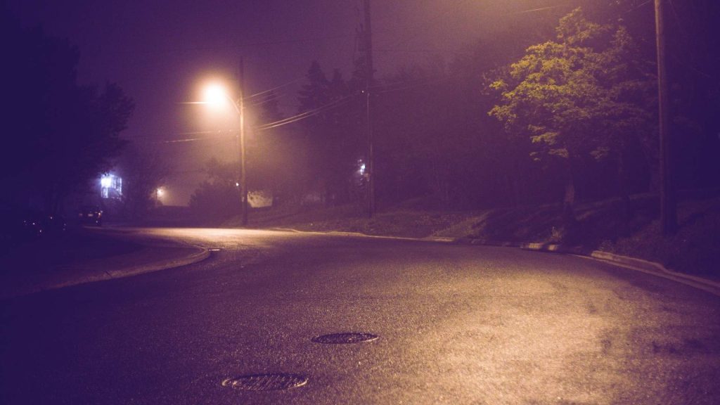 Quiet street at night representing the isolation and risk surrounding heroin overdose emergencies.