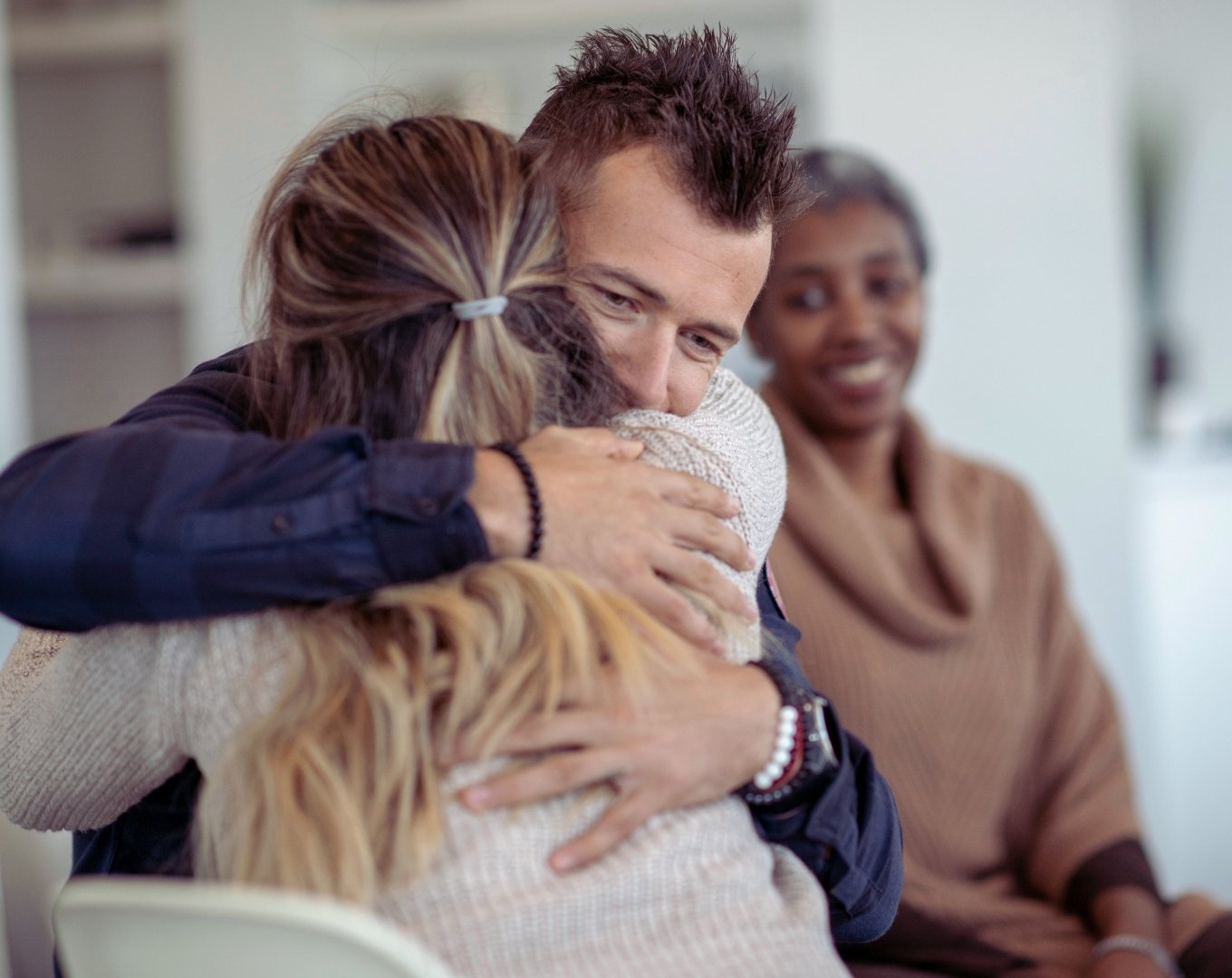 man and a woman hug each other