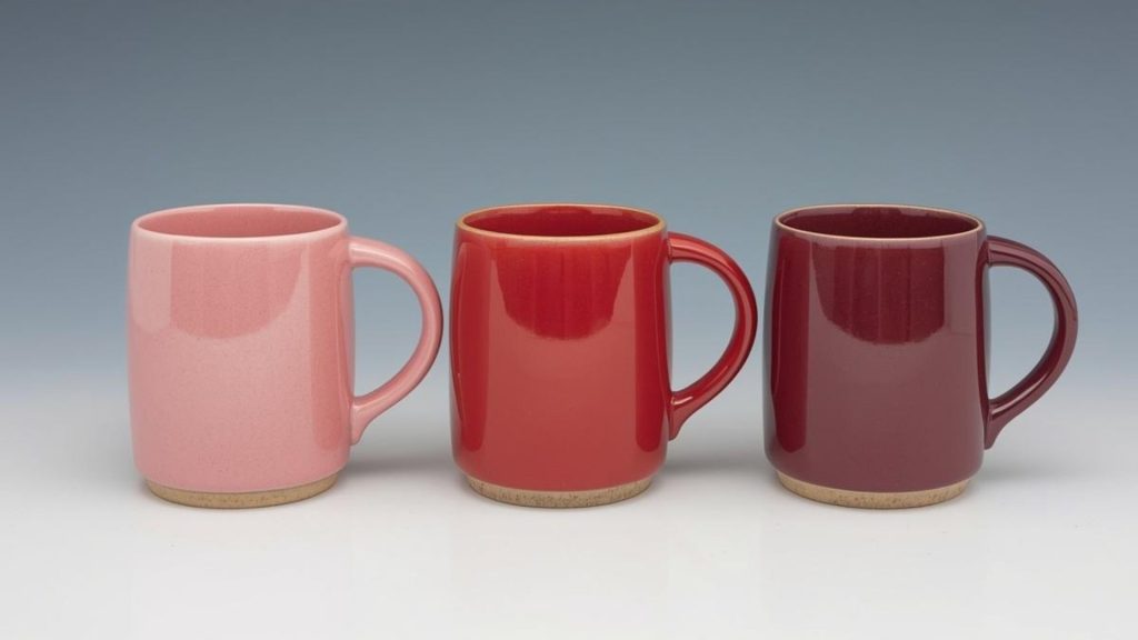 Three mugs representing the stages of alcoholism from early use to dependence